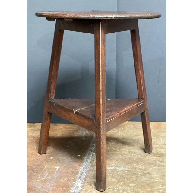 A handsome English cricket table of patinated oak from the Georgian Era, featuring the traditional round or circular top...