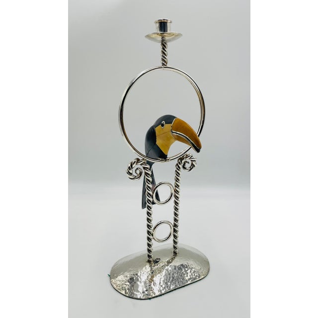 A whimsical and sculptural silver-plated candlestick designed and handcrafted in Taxco, Mexico by celebrated artist Emilia...