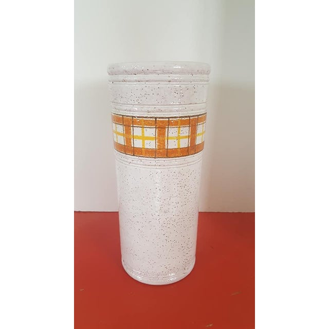 A sexy and straightforward tall vase with by Bitossi....orange accents on a natural overall glaze delivers the subtle...