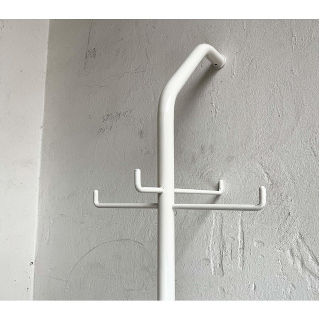 Minimalist wardrobe. This design is hard to beat in terms of simplicity and functionality. An angled tube made of white...