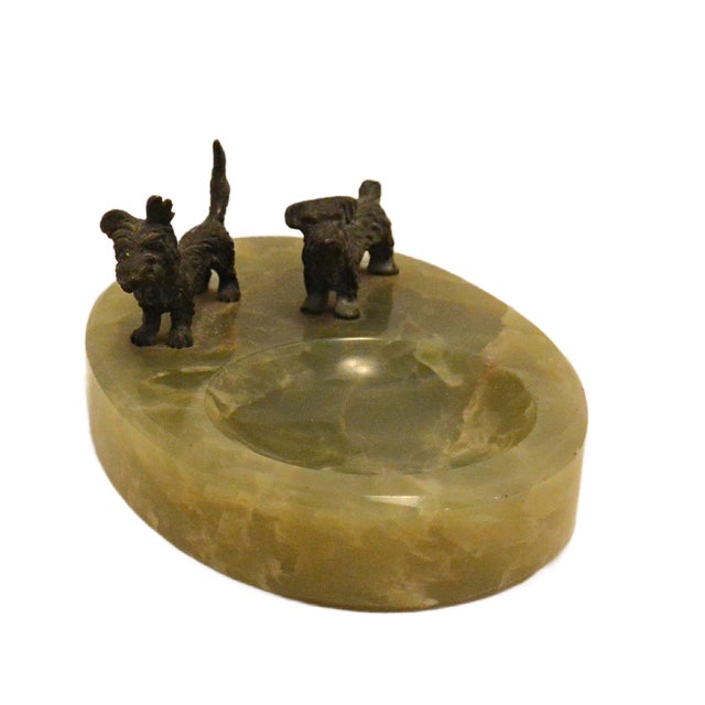 A definitive statement of 1930s luxury, this Art Deco desk tray features not one, but two alert Scottish Terriers standing...