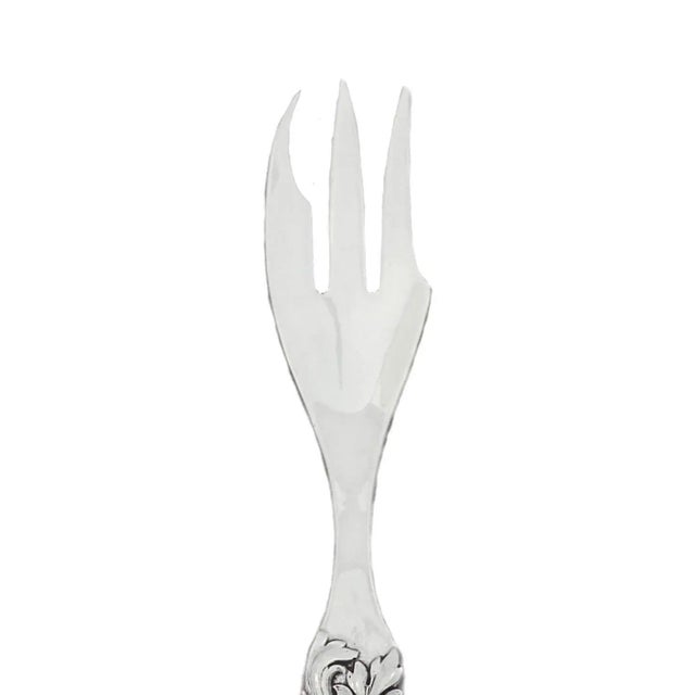 This sterling silver serving fork is a great mix between sleek and ornate. The handle has a beautiful design of flowers...