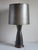 Stunning Mid-Century Modern ceramic gray gun metal hourglass form large table lamp with original matching shade. The lamp...