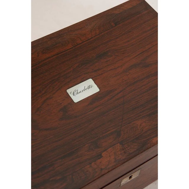 Dimensions: 13” H x 14 ½” W x 9 ½” D A French traveling writing box made of rosewood during the 1800’s. The top of the box...