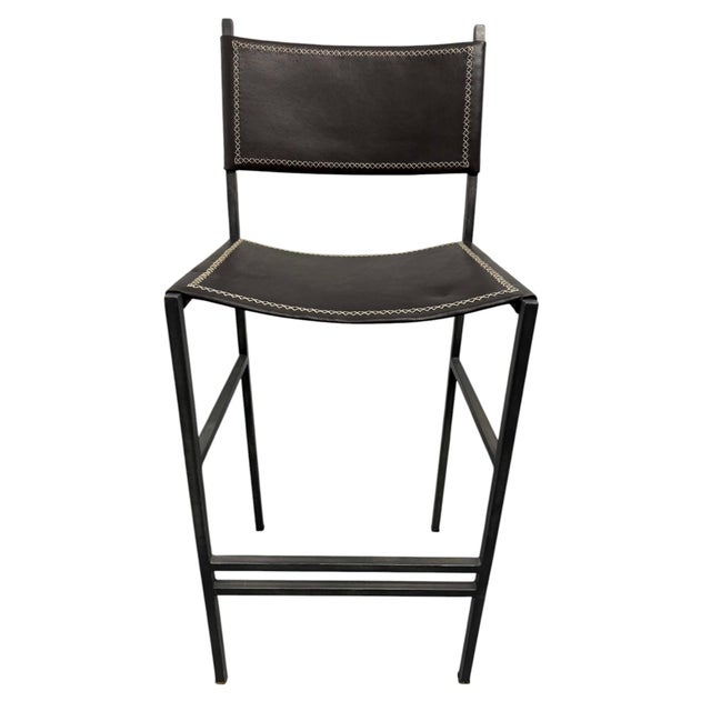 Quick Hits: Sol & Luna brown leather and iron bar stool Rich brown leather seat, contrasting iron frame Hand-stitched...