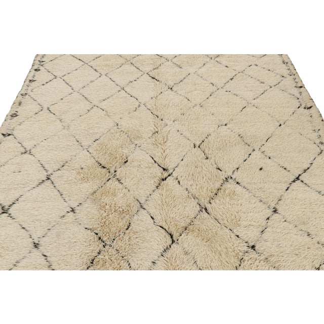 Hand-knotted in wool and originating from Morocco circa 1950-1960, this 7x14 vintage Moroccan rug is an extremely rare...