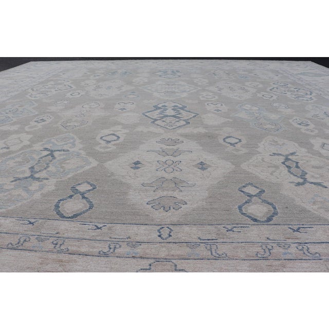 Turkish Oushak Rug With Soft Gray Field and Pale Blue Geometric Motifs For Sale - Image 14 of 16