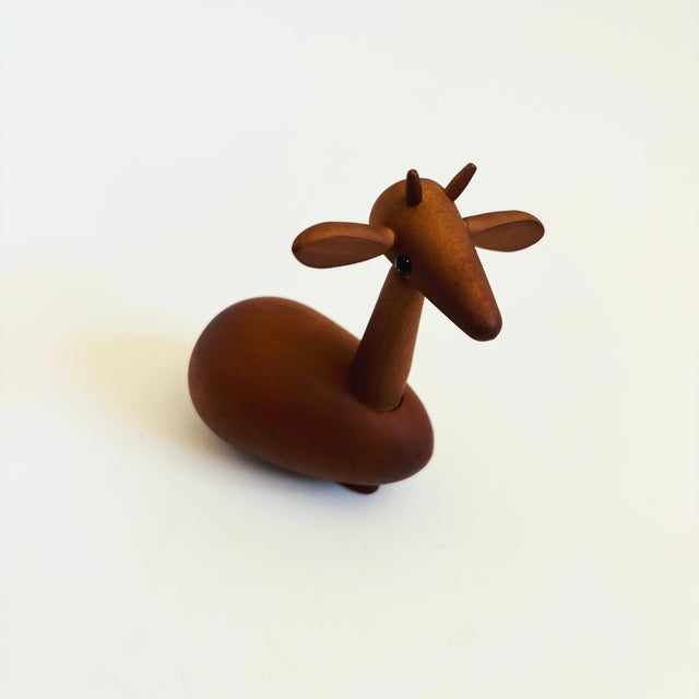 A mid century turned wood figurine in the shape of a deer. Adorable stylized features. Made in Japan by Senshukai as part...
