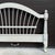 An early 21st century Ethan Allen Country French / Maison collection wheatback full size footboard in distressed beige....