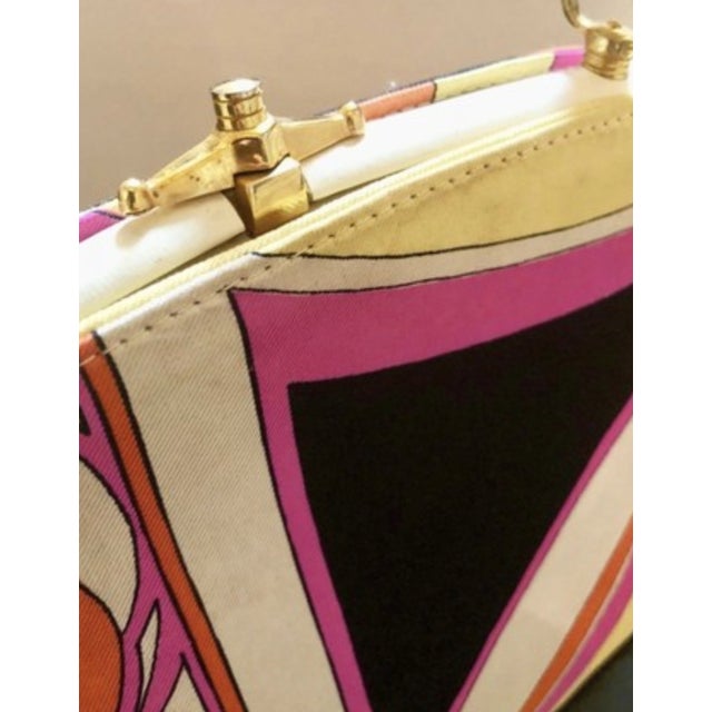 Iconic silk and leather 1960s purse by Jana for Emilio Pucci. Gorgeous black, white, pink and yellow pattern. Dimensions...