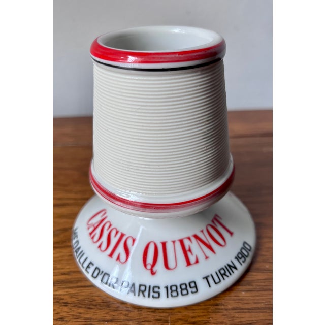This charming vintage French match holder/striker was made to advertise Cassis Quenot liquer from Dijon, France. Would be...