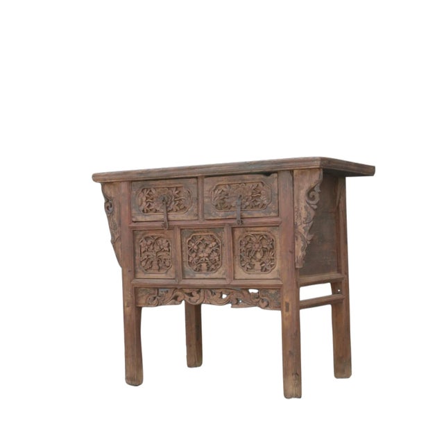 This early 19 century antique Chinese 2 drawers chest showcases exquisite hand carved drawer fronts and sides. Aged earth-...