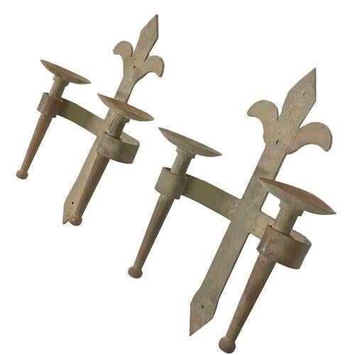 Pair of vintage iron fleur de lis candle wall sconces. No maker's marks.