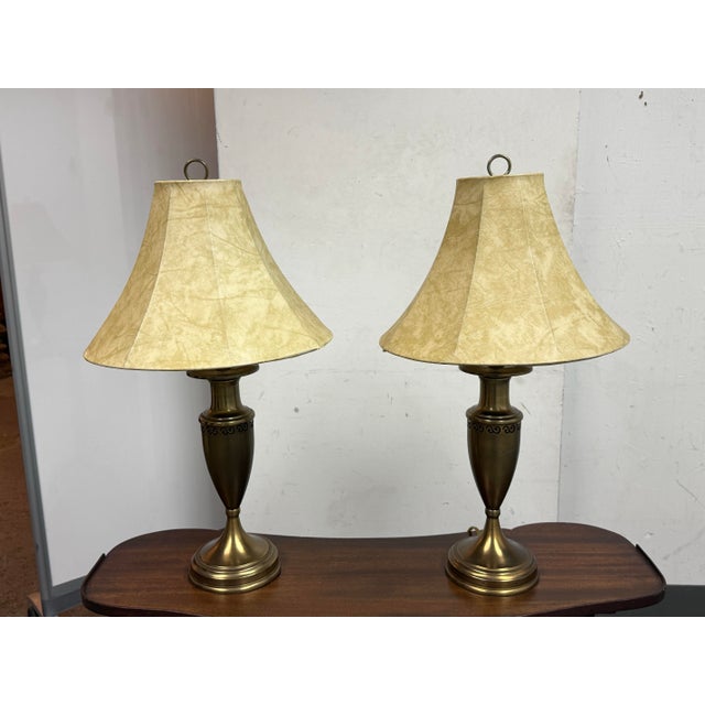 Design Plus Gallery presents a Pair of Traditional Urn Style Table Lamps from Lamps Plus. This matching pair has antiqued...