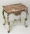 Country French center table or console carved and painted in pale sage green with. rouge marble top and gilt wood accents,...