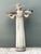 This vintage garden figure is cast in stone and stands with a calm, classical presence. The draped figure holds two...