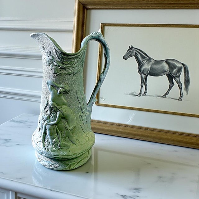 This exquisite Edward Walley relief-molded pitcher is a standout example of mid-19th-century Staffordshire Parian...