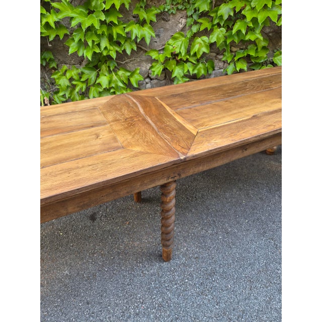 Large antique French work table dating from approximately 1750–1850, made of solid oak. The table was originally used in a...