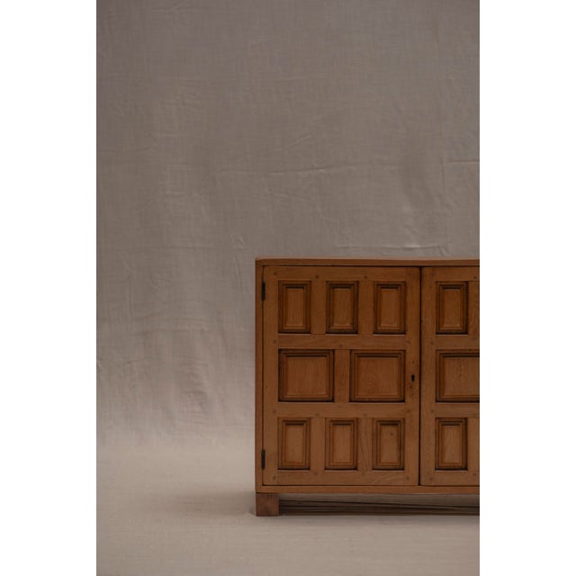 A striking Brutalist sideboard from 1970s Spain, crafted in solid oak with a natural, light finish. The design is defined...