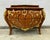 Experience the grandeur of European craftsmanship with this magnificent French Rococo-inspired dresser, masterfully...