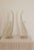 A graceful pair of Austin Sculpture frosted art glass swans featuring elegant elongated necks and flowing organic forms....