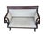 An elegant antique Empire Revival settee featuring dramatic rolled scroll arms, carved paw feet, and a richly figured...