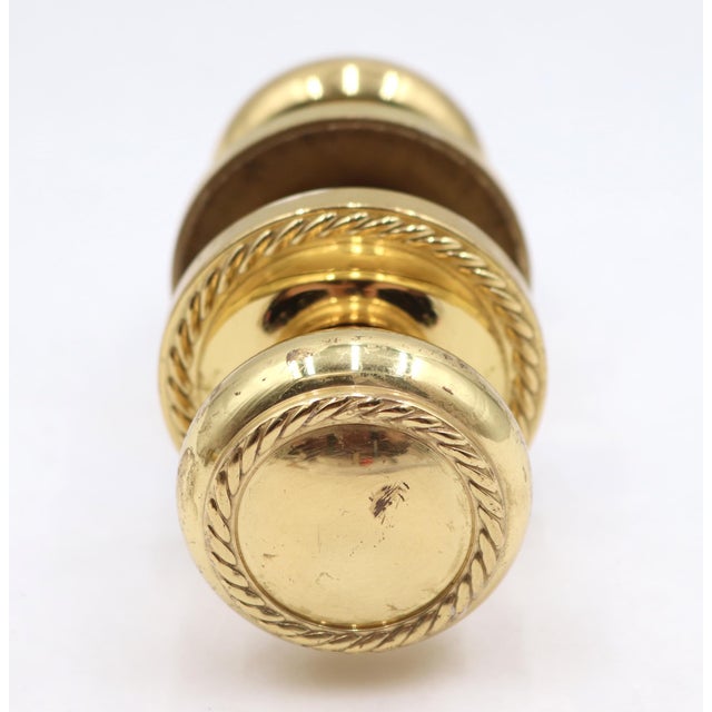 Reclaimed Traditional passage door knob set made of polished brass with a rope design. Priced as two door knobs, two...
