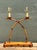 This vintage double arm lamp is crafted from metal finished to convincingly resemble faux bamboo, blending an organic...