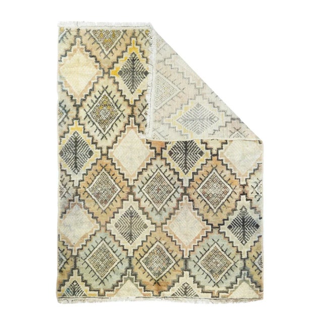 This totally borderless Berber, coarse weave, high pile scatter, shows a stepped lozenge lattice with the reserves...