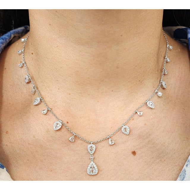 This exquisite necklace embodies modern elegance and sophistication. The necklace boasts 2.85-carat mixed-cut natural...