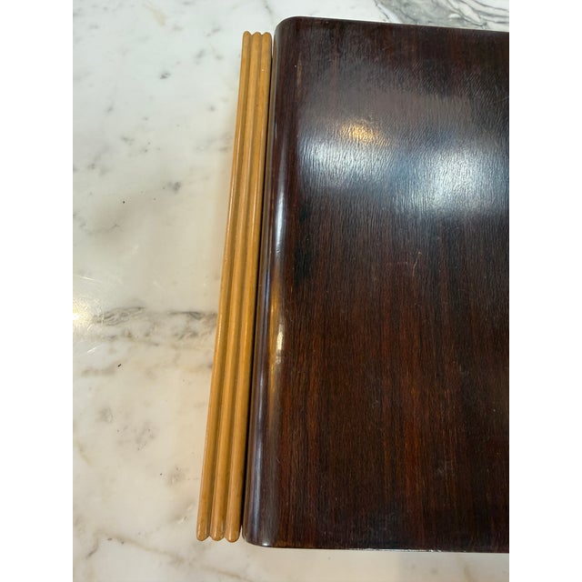 Elegant mid-century modern wooden storage box featuring a rich dark walnut-toned exterior, contrasting light wood trim,...