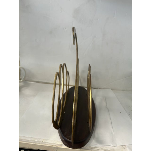 Beautiful brass swan shaped magazine rack after Maison Jansen. The Hollywood Regency style would work in any upscale...