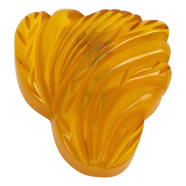 Apple-Juice Bakelite Brooch or DressClip with Floral Carving For Sale