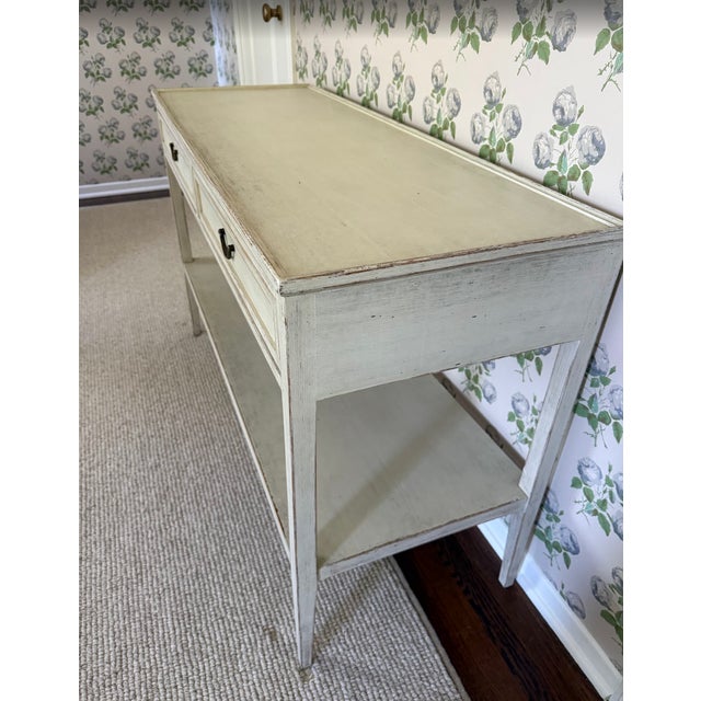 This console table is handmade and hand painted. The solid wood legs and frame, are crafted from sustainably sourced teak....