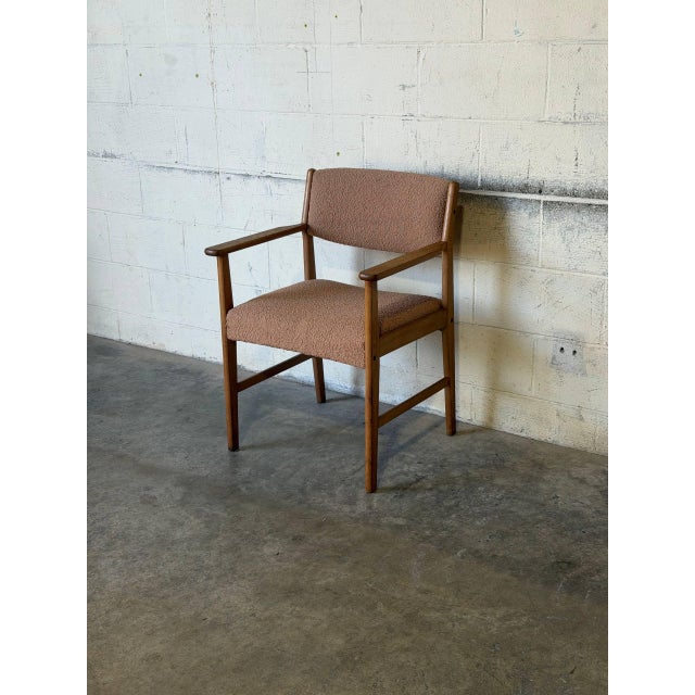 Crafted in Denmark, this elegant armchair features clean Scandinavian lines and a sturdy solid oak frame. The warm natural...