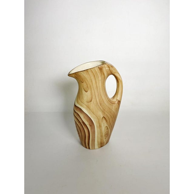 Ceramic pitcher with faux wood decoration, France, 1960s. This original glazed ceramic pitcher imitates the natural look...
