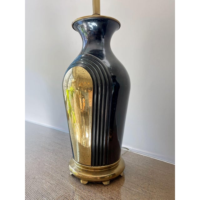 A striking pair of vintage 1980s table lamps showcasing a refined Postmodern interpretation of Art Deco design. Defined by...