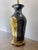 A striking pair of vintage 1980s table lamps showcasing a refined Postmodern interpretation of Art Deco design. Defined by...