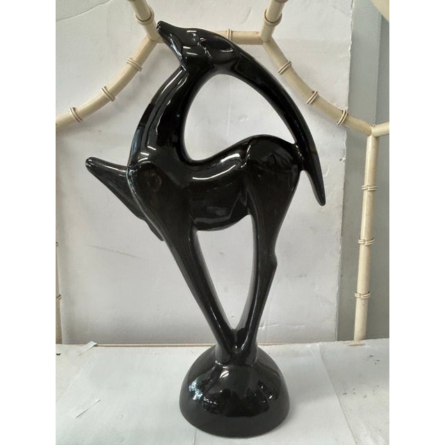 Beautiful black gazelle sculpture by Haeger has a Neo deco style and is from the 1980s. Great design that would look great...