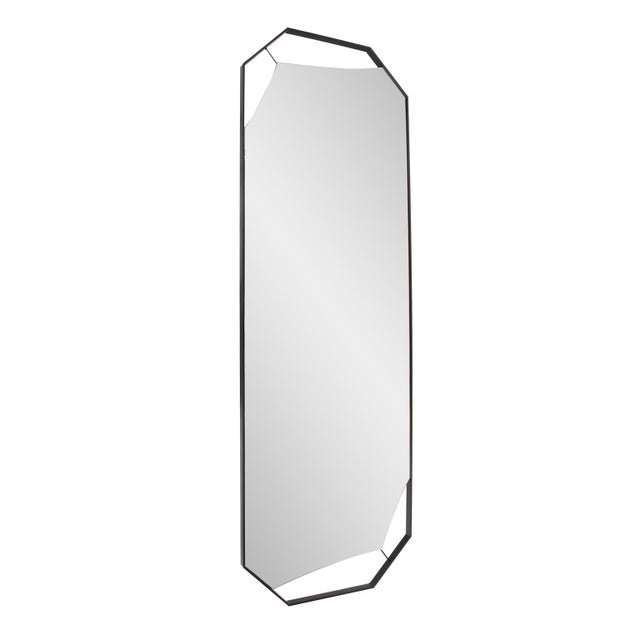 This elegant mirror features a distinctive octagonal design with sleek cut out beveled edges. Encased in a slim black...