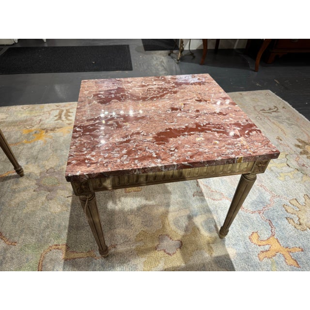This is a vintage Louis XVI Style marble top side table. The marble features burgundy, rose and blush pink warm toned...
