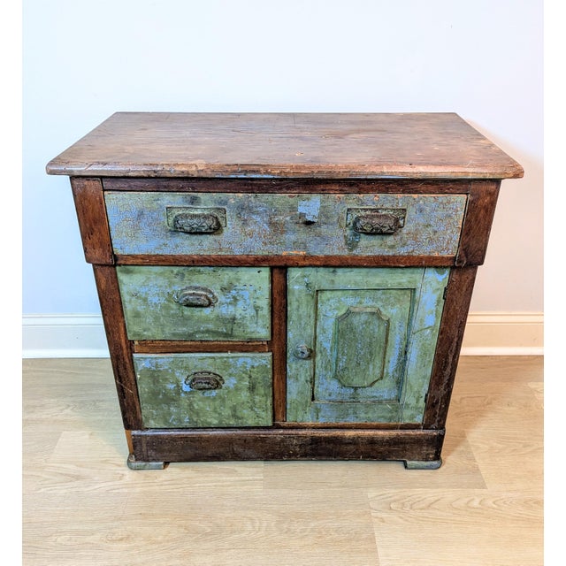 Bring authentic rustic warmth to your space with this late 19th-century (circa 1890) American country cabinet. Brimming...