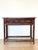 Chinese center console table, worked on all 4 sides, 19th century, lacquered bamboo structure and lacquered wood top.