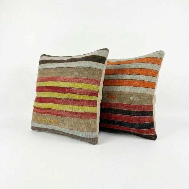 This beautiful 24'' x 24'' pillow cover set was made from authentic Turkish rug pieces. Bright colors of wool adorn the...