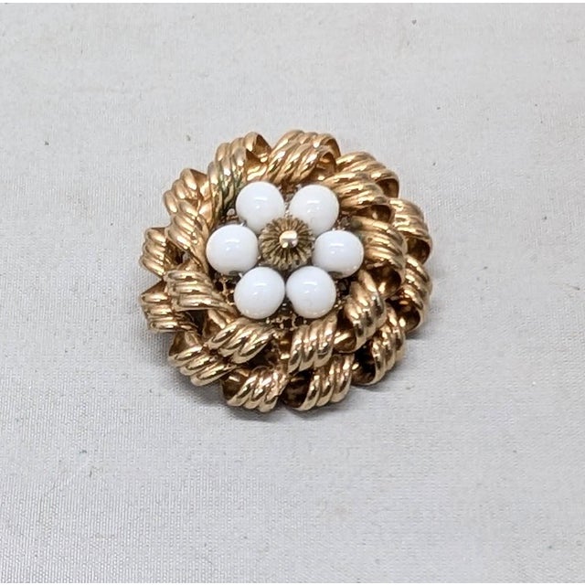 1950s round goldtone two layered circles of curled goldtone with white glass beads ribbed goldtone bead center brooch with...