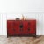This wonderfully rich red antique Chinese sideboard has one large open cabinet with one shelf to provide abundant storage...