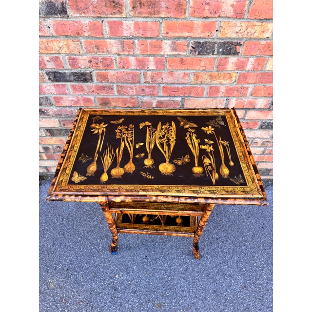 This 19th Century English Bamboo Side table features a delightful variety of vegetables decoupaged onto the top and lower...