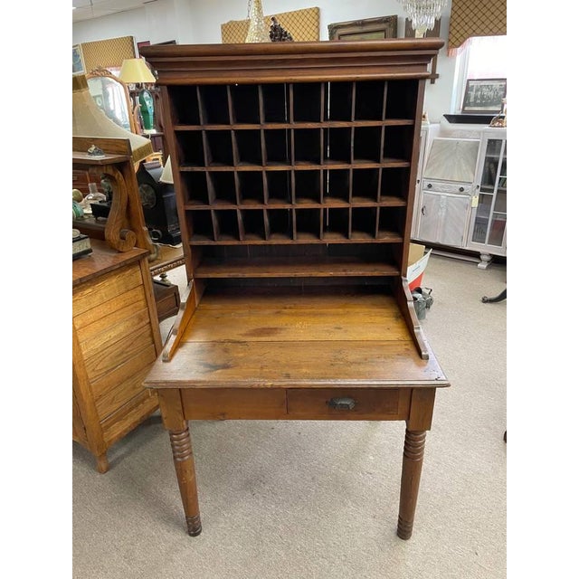 Up for sale is a very rare and unique wooden antique cabinet. This is a Primitive Mail Sorting Desk Cabinet, used to...