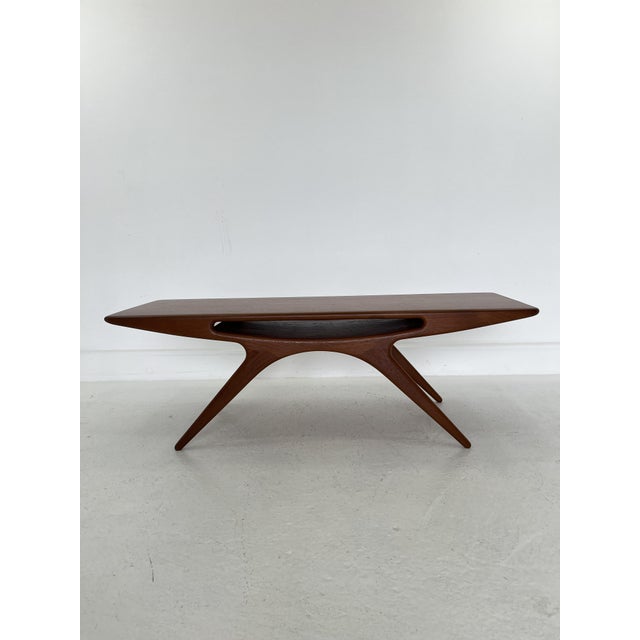 Completely restored Coffee table, model “Smilet”, designed by Johannes Andersen and produced by CFC Silkeborg in the...