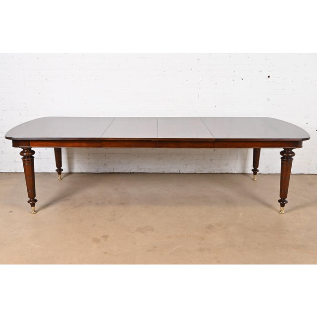 A gorgeous English Regency or Empire style extension dining table By Baker Furniture, "Milling Road Collection" USA, Late...